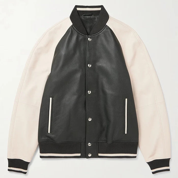 Laid flat black leather varsity jacket with beige sleeves.