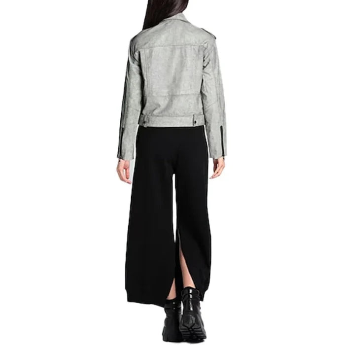 Back view of model wearing a gray crop moto jacket and black pants