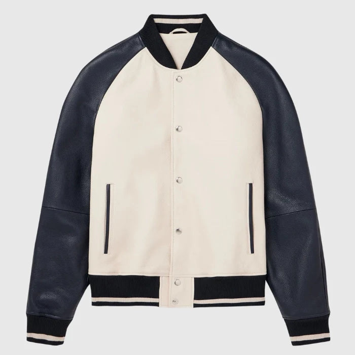Front view of men's beige varsity jacket with black leather sleeves and snap button closure.