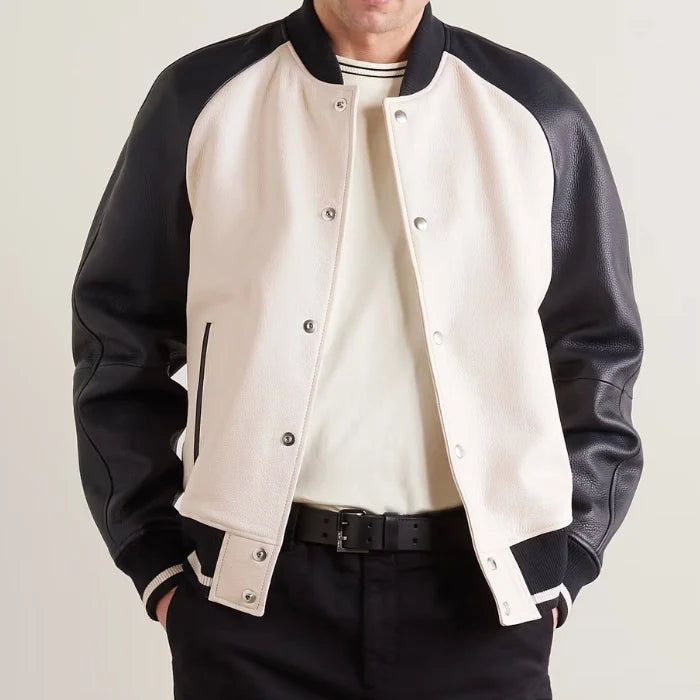 Front view of men's beige varsity jacket with black leather sleeves and snap button closure.